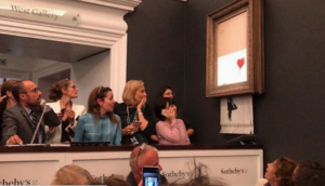 VIDEO | Obra de Banksy se autodestruye después de ser vendida por más de un millón de dólares